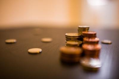 QuickBooks vs ERP - piles of coins QuickBooks vs ERP - piles of coins