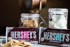 A stock, close-up photo of two Hersheys chocolate bars near jars by Tony Clay from Pexels